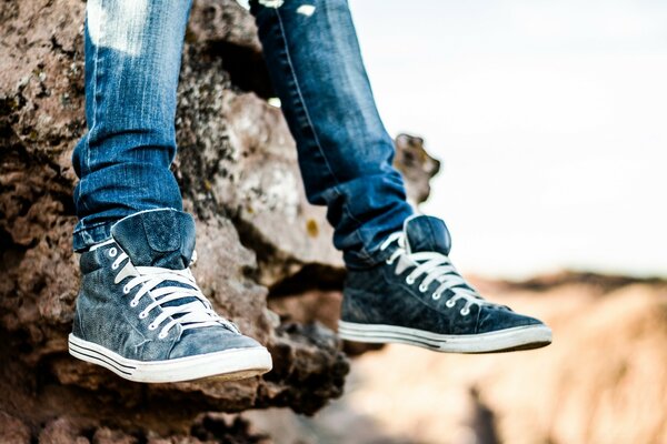 A man in jeans and sneakers