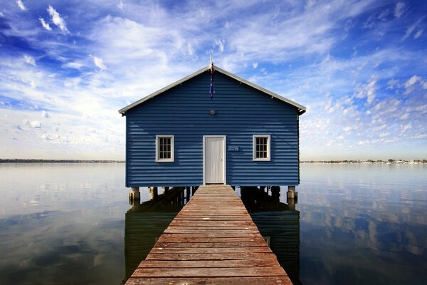 A house on the water. Sky and water