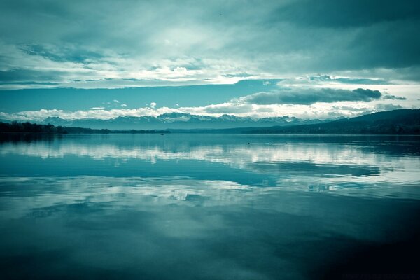 Reflection of the sky and clouds in a clear lake