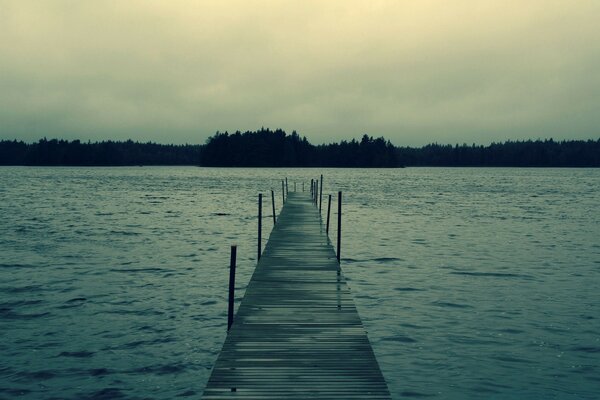 Log bridge on a small lake