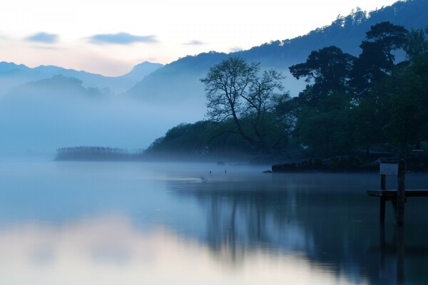 Blue lake. Foggy weather