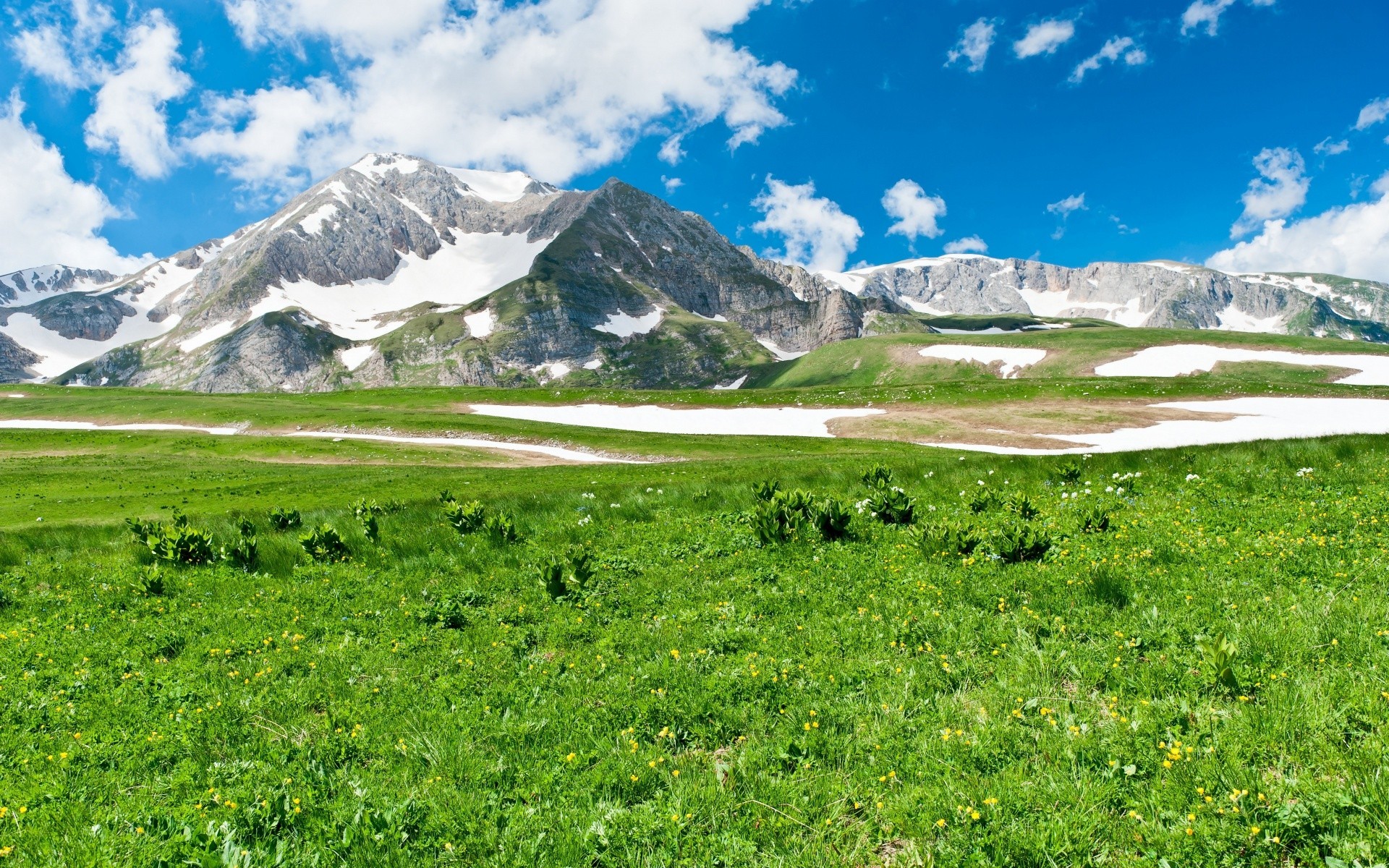 primavera paisaje montañas naturaleza viajes cielo al aire libre escénico hierba verano heno luz del día valle pico de montaña colina vista nube nieve agua