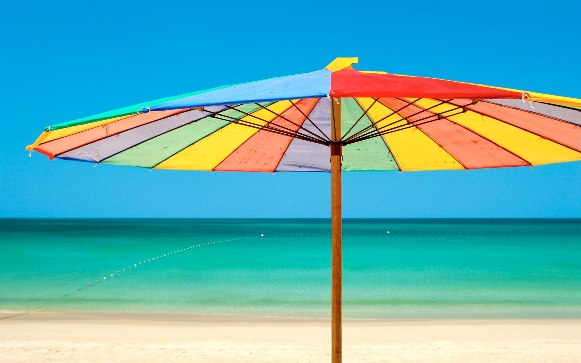 verão guarda-chuva areia céu dossel praia viagens férias sol tropical ao ar livre férias água natureza