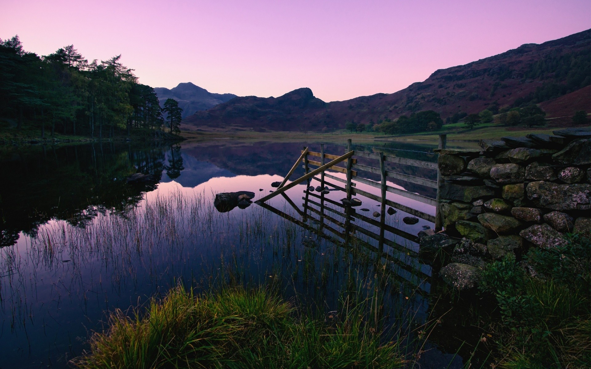 lake landscape water river mountain travel nature sky scenic reflection outdoors tree wood sunset dawn rock bridge grass