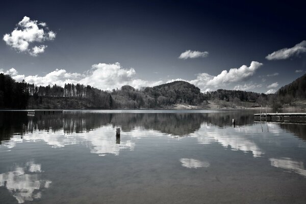 The river surface reflecting the sky clouds