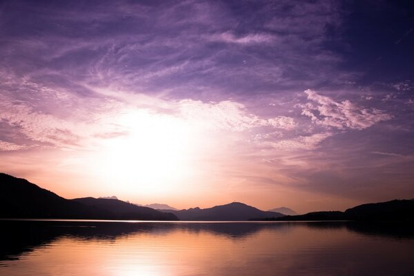 SUNSET OVER THE WATER SURFACE