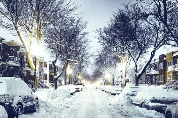 Snow-covered narrow road in the city