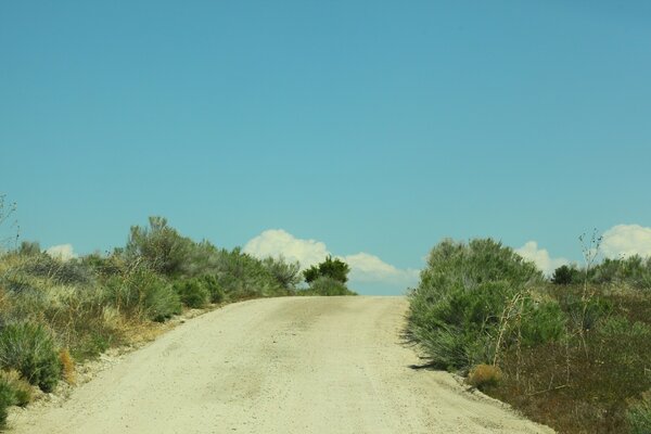 A deserted road stretching into the sky