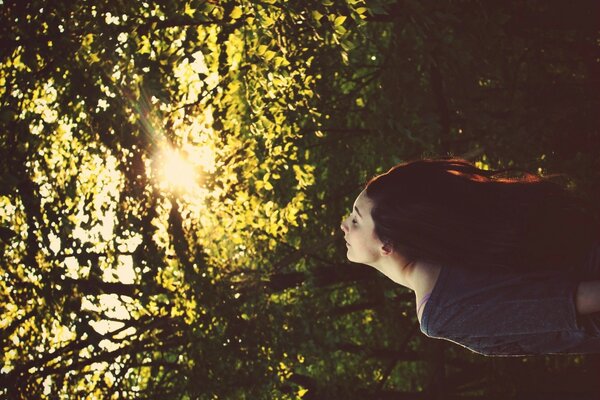 A girl enjoys nature in the forest