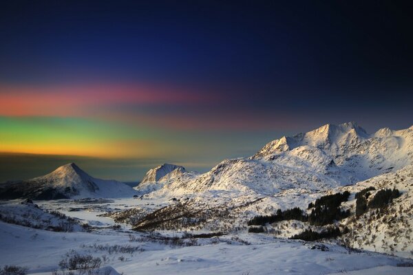 Northern Lights beyond the mountains