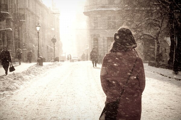 A lonely girl on a winter street