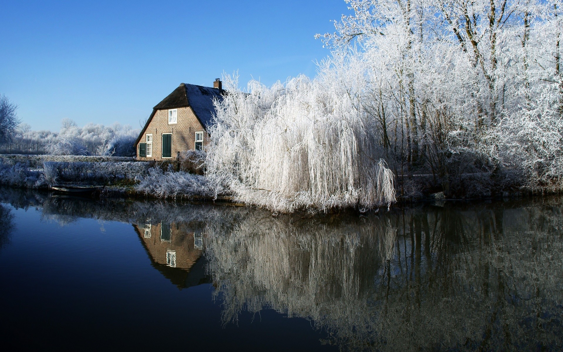 winter water snow outdoors landscape cold nature sky tree travel reflection wood ice frost