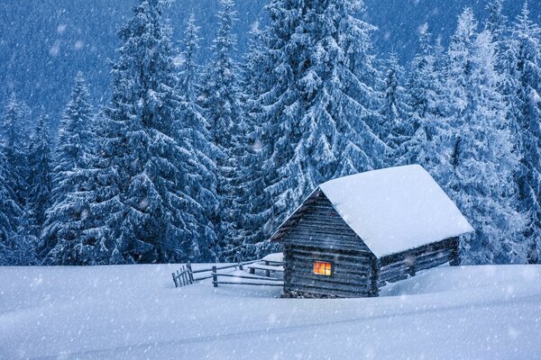 A residential hut in the winter forest