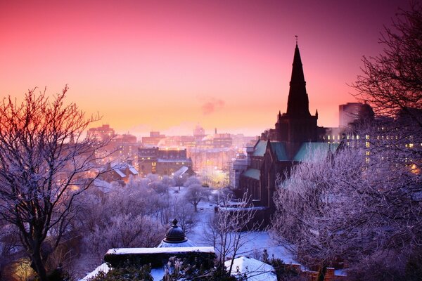 Beautiful sunset on the background of the city