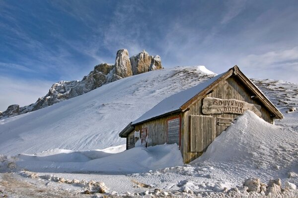 A hut in the snow in the mountains