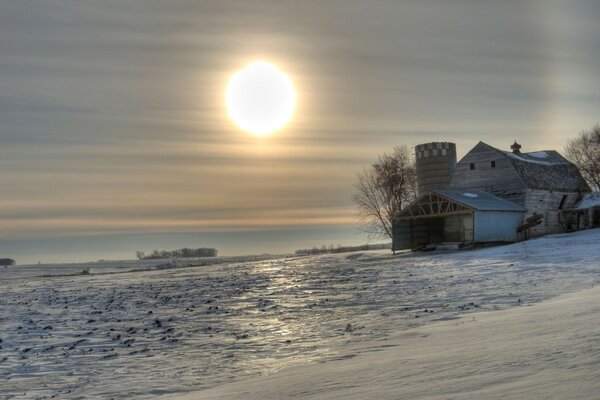 Big sun on the background of snow