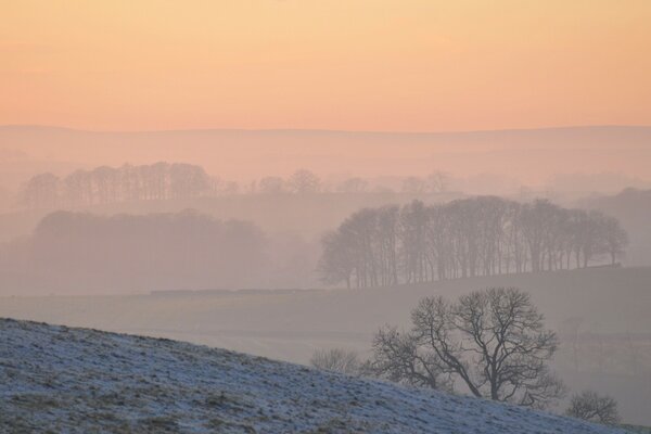 Snow-dusted hilly terrain