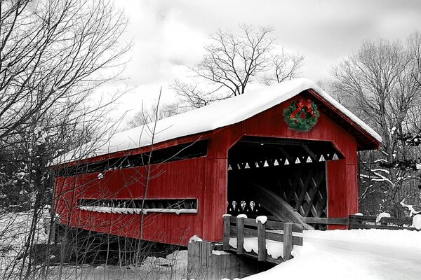 Bridge over the river covered with snow