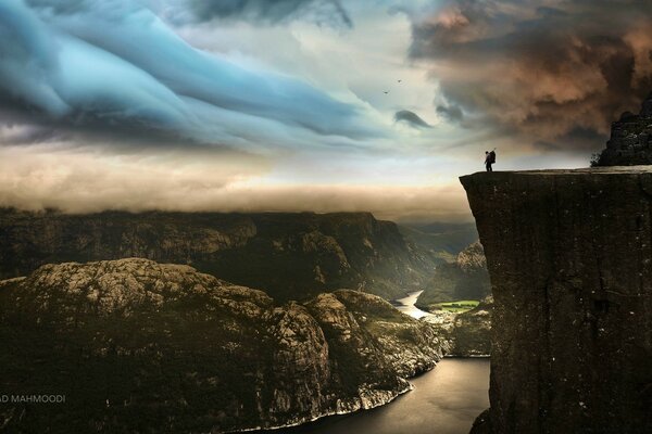 A lonely wanderer at the cliff edge