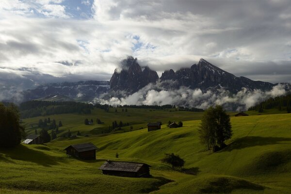 Houses in the mountains, fresh air and fluffy clouds under the window