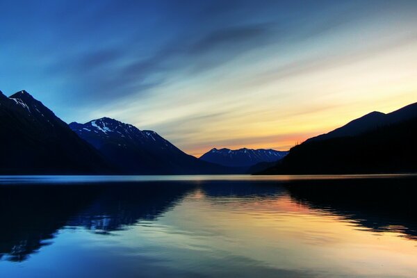 Lake and mountains on the background of a beautiful sunset