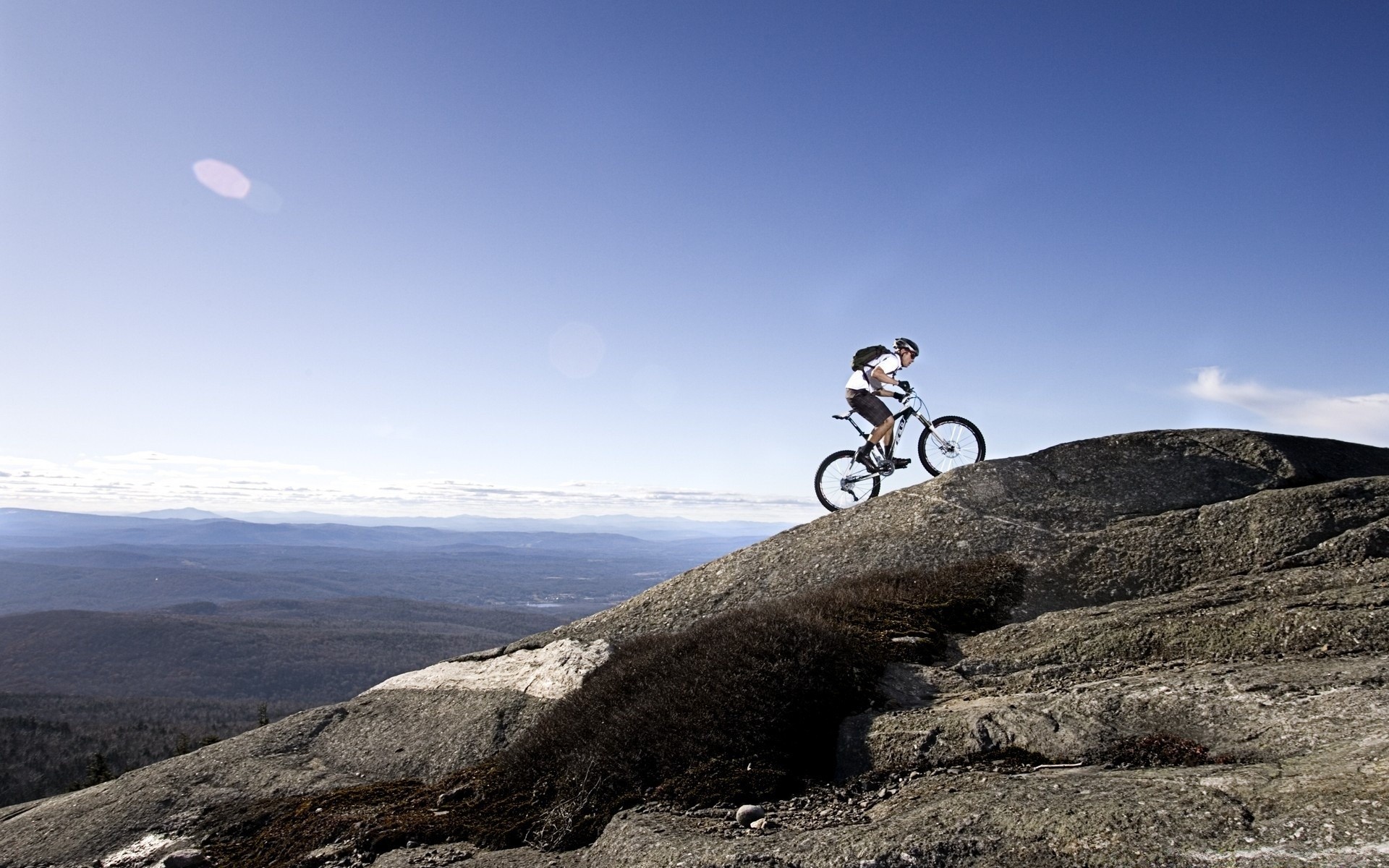 cycling landscape mountain sky travel adventure outdoors hill road rock nature sport recreation daylight