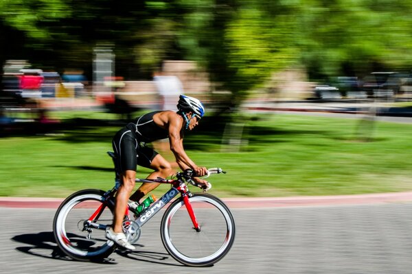 A cyclist on the background of city streets