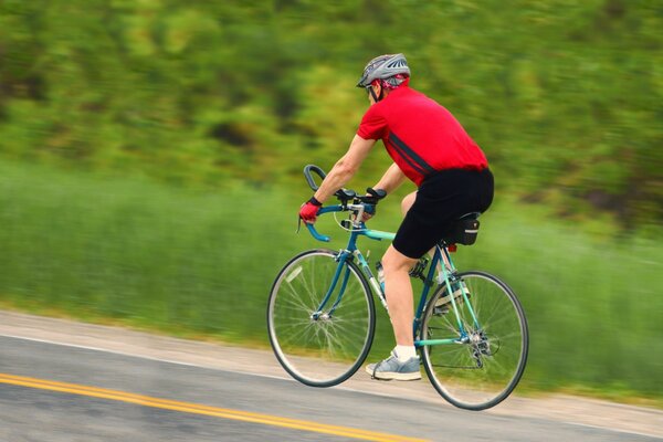 Cyclist rides fast on the road