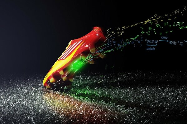 Football boot on the grass