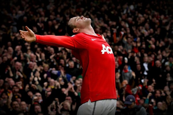 The footballer celebrates scoring a goal