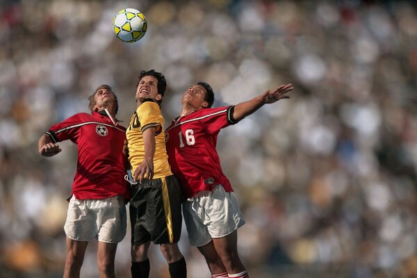 Fighting for the ball at a football match