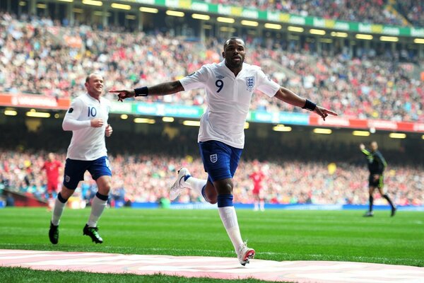 The athlete rejoices at scoring a goal