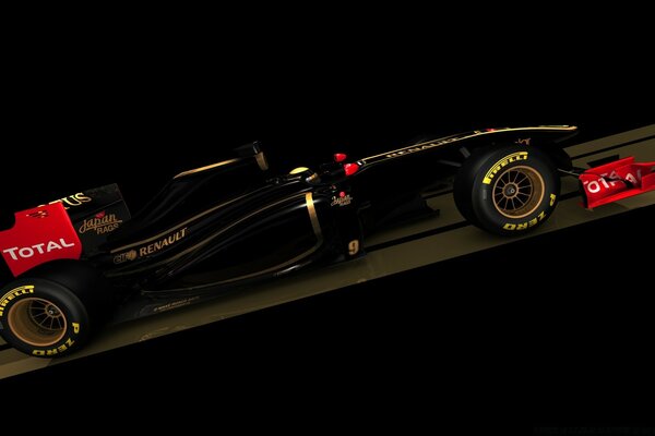 A black car, on a black background. Formula One, yellow wheels