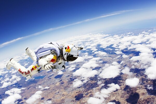 An astronaut hovers in the air and sees the earth