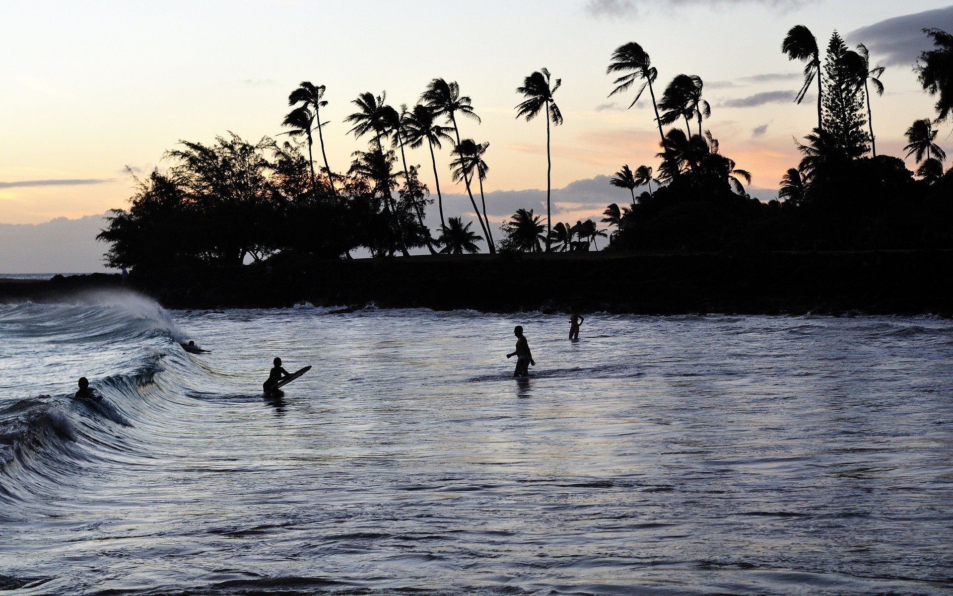 surfing water ocean beach silhouette seashore sunset sea evening recreation reflection travel leisure backlit dawn summer