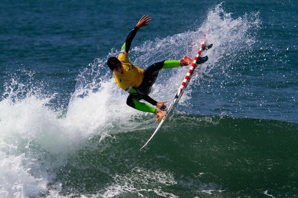 Surfer bounces on a board on the waves