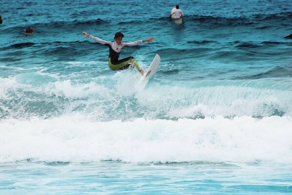 Surfing on a wave in the ocean