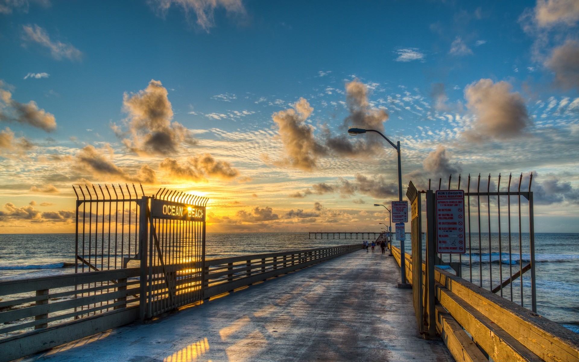 america beach sunset water sea dawn pier travel ocean seashore sky fence bridge sun landscape boardwalk outdoors dusk evening light