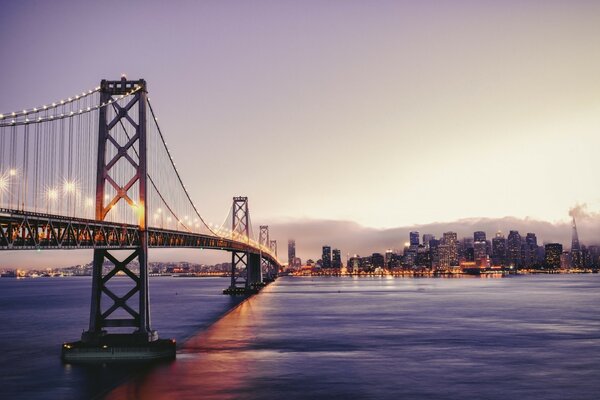 A bridge across the waters leading to the metropolis