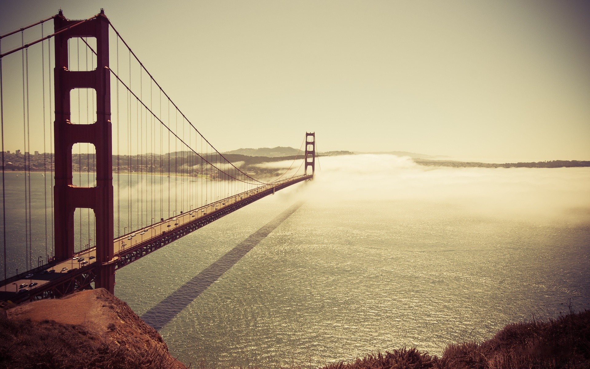 america water bridge sea sunset dawn ocean beach seashore landscape suspension bridge transportation system light travel reflection evening bay river vehicle sky