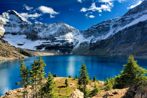 Mountains dusted with snow, above the lake