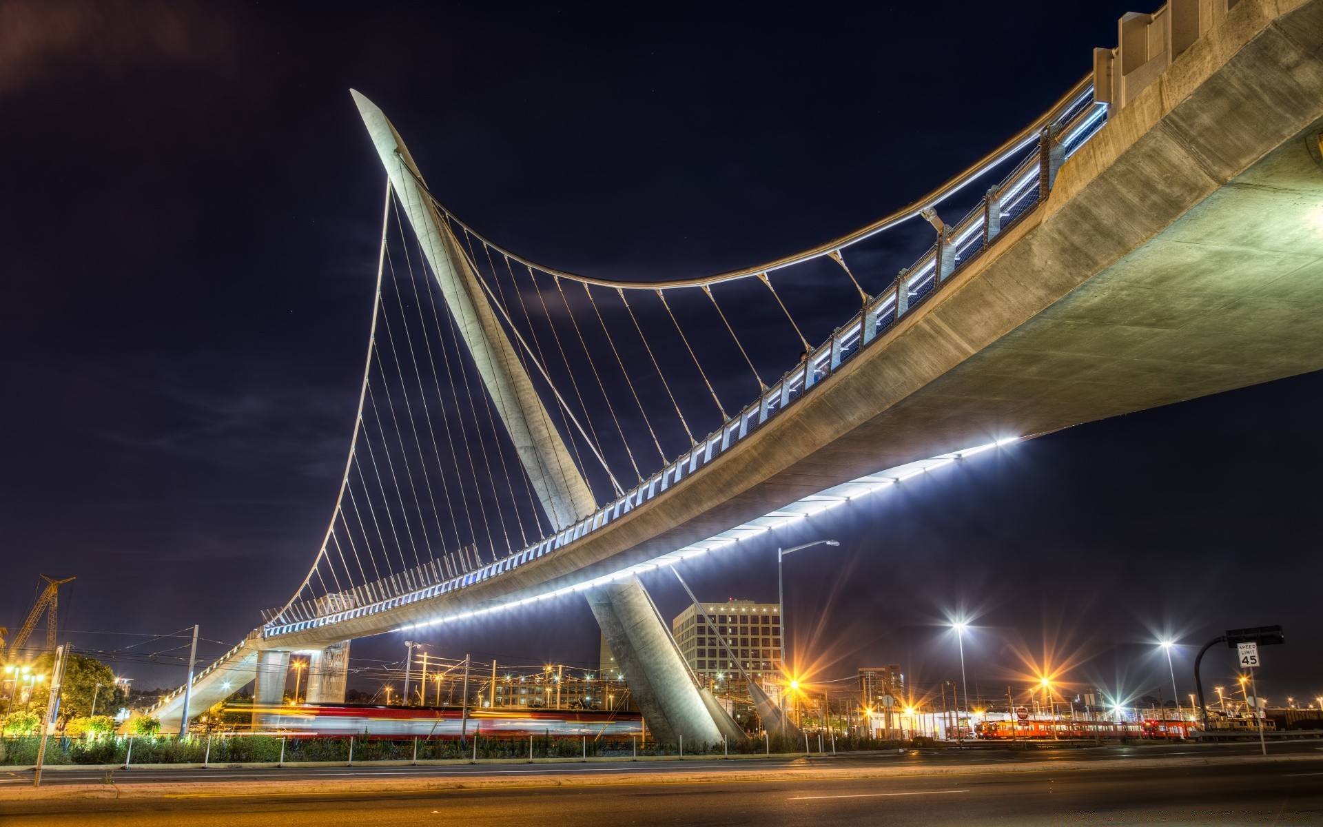 america bridge transportation system city road traffic architecture building urban highway travel downtown dusk modern street blur sky evening construction car cityscape