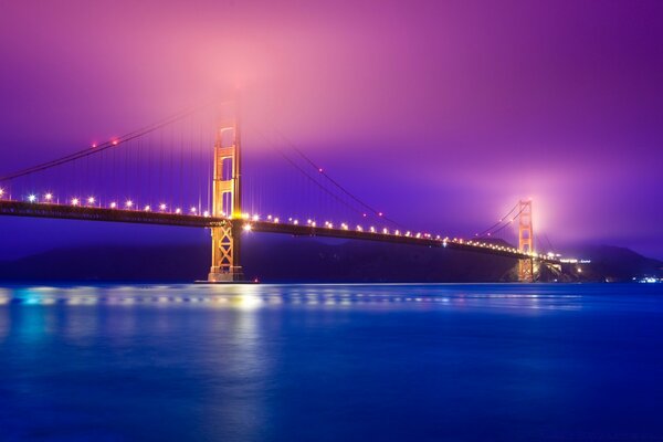 Night bridge illuminated by lanterns