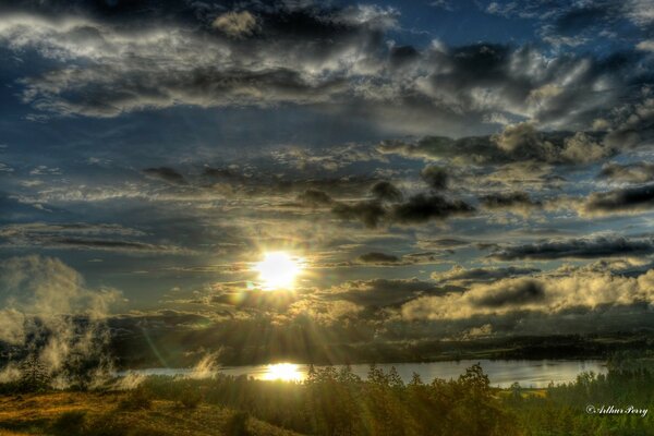 Dark sky in the rays of the departing sun