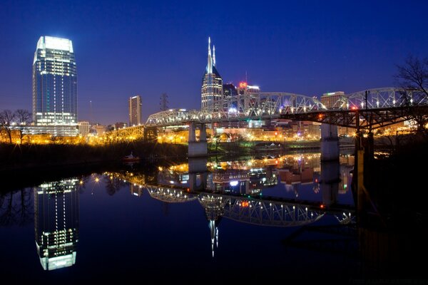 Night city in the reflection of the river