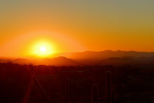 Sunrise over massive mountains