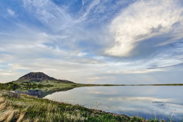 Mountain lake merges with the sky