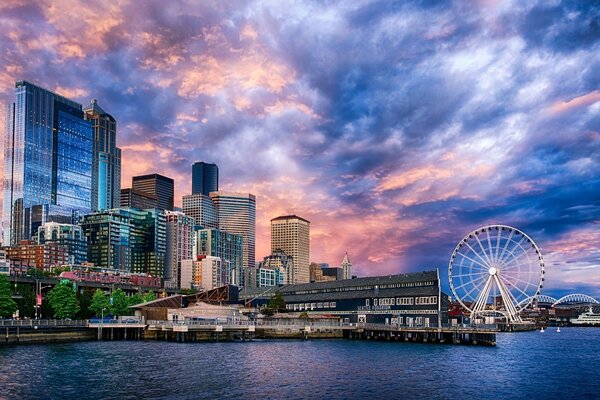 Architecture of the city with a Ferris wheel