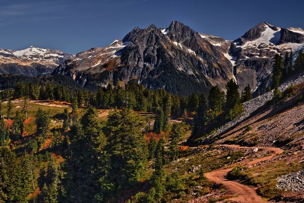 A large mountain valley is flooded with light