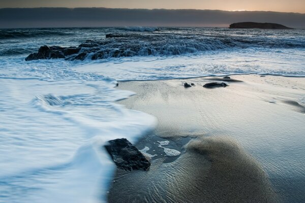 Ocean shore, foam on the water